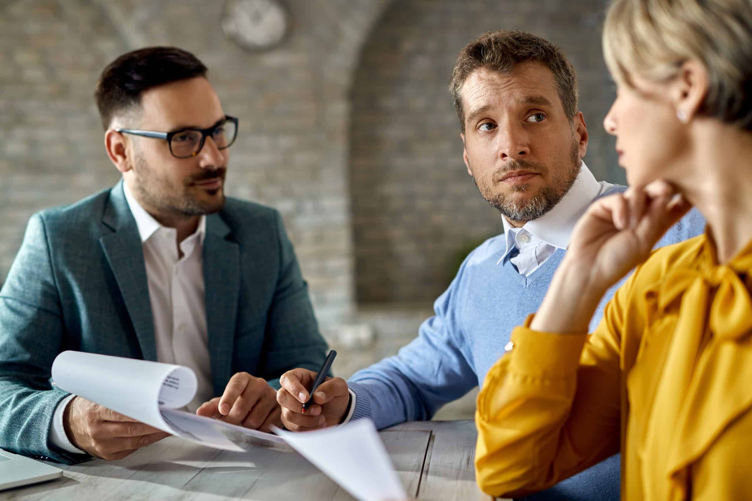 Couple being counseled by a financial adviser.